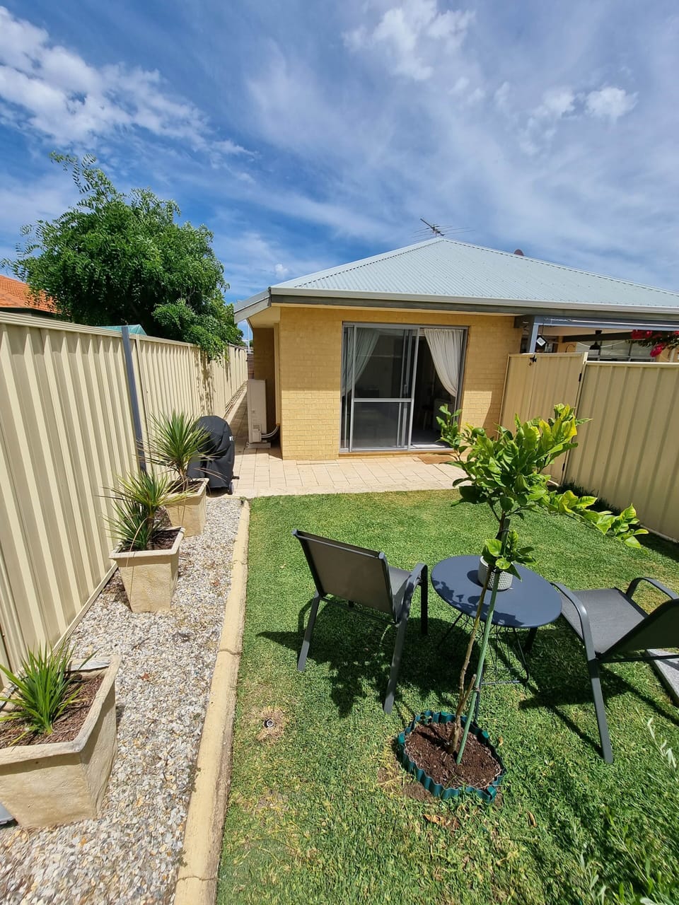 Secluded lawned garden with BBQ