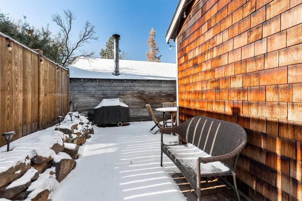 Small fenced area w table, barbecue, accessible via gate