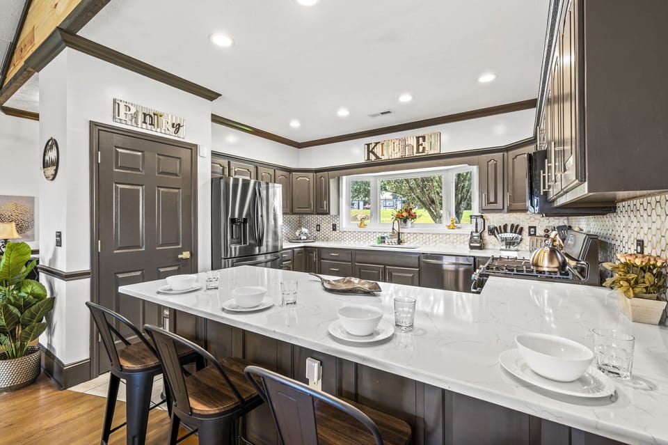 A stylish yet functional dining and kitchen area, perfect for sharing memories over food and drinks   