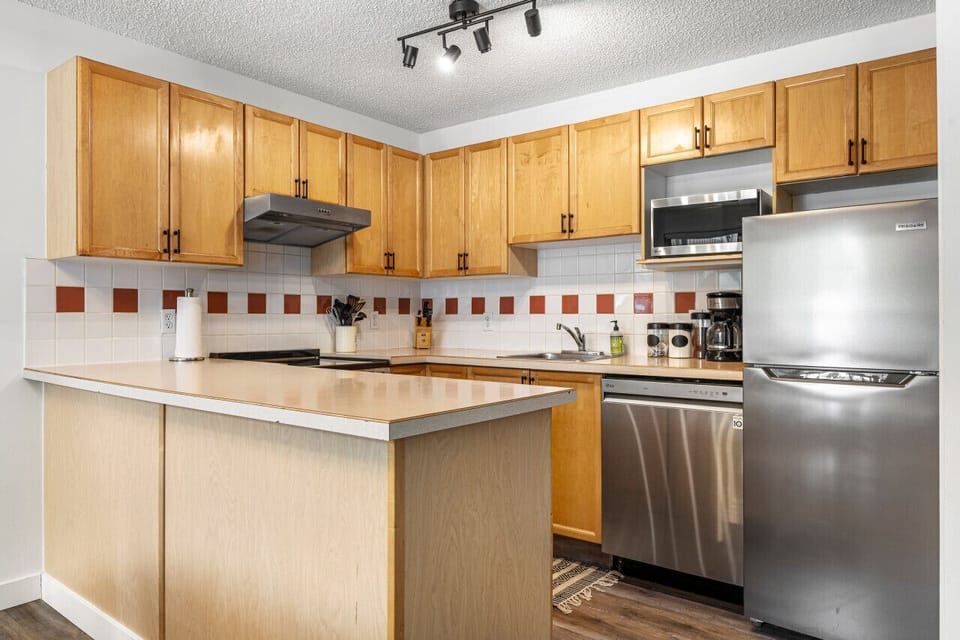 Full kitchen with a drip coffee machine, ground coffee, tea, sugar and basic condiments (ketchup, mustard and relish.)