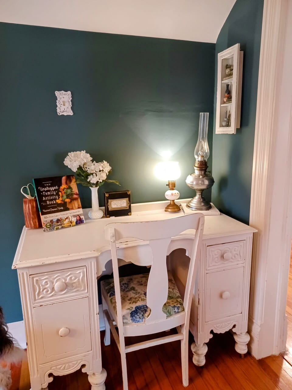 The large work desk, located in a common area in the upstairs landing space.
