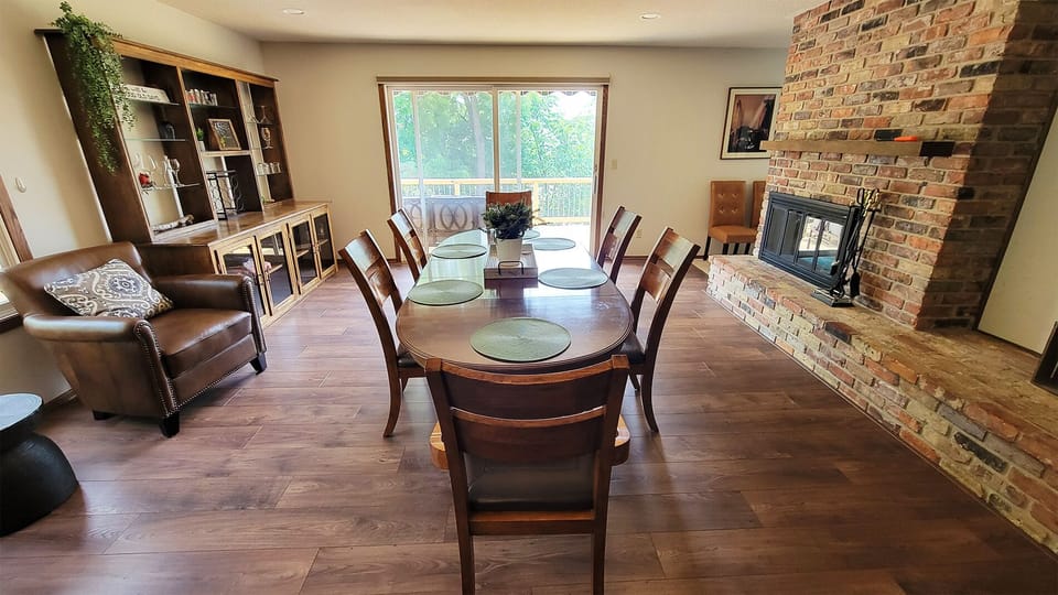 Great open area dining room and kitchen with mounted TV and Fireplace.