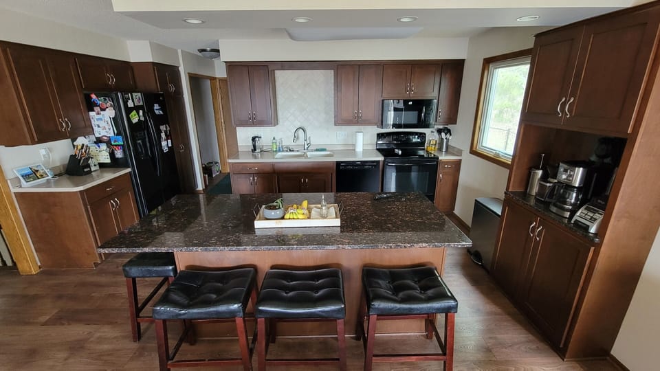 Kitchen with Island, 2 ovens, coffee station, toaster, microwave, and more.
