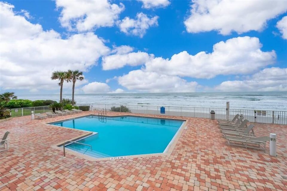 Enjoy sitting by the pool with a direct view of the Atlantic Ocean in Ponce Inlet Florida.