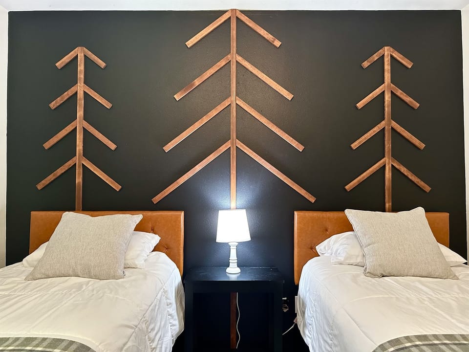Wake up in the trees!  Bedroom 3 - The Tree Room offers 2 Twin XL (extra long) beds.  We also have a kit that joins the two beds together to make it a king bed.