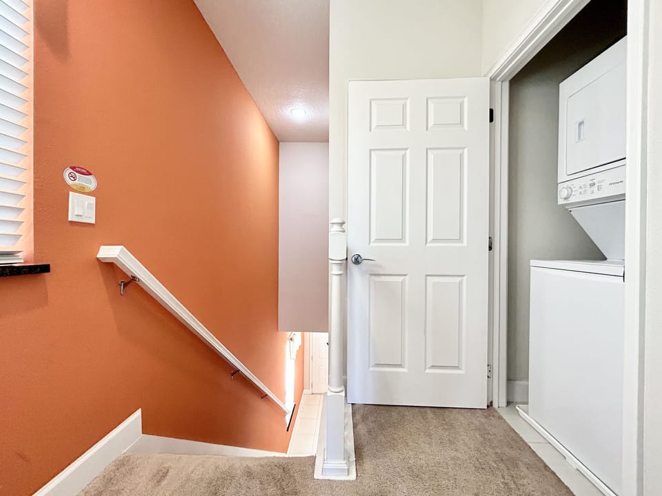 Fully-equipped laundry room with washer and dryer