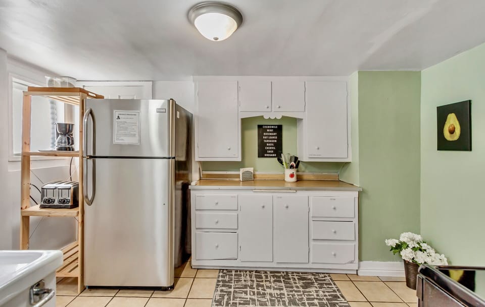 Kitchen includes all the basics—pots/pans, coffee maker, pantry items, and more.
