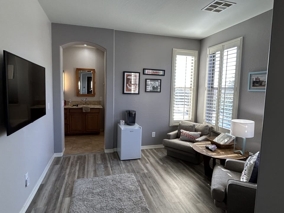 Master suite sitting area with Keurig and mini fridge