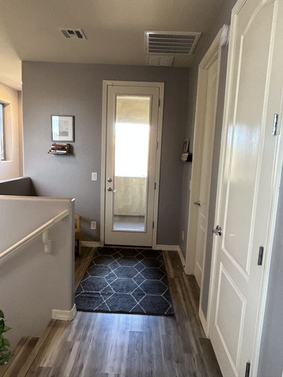 Upstairs hallway leading to balcony