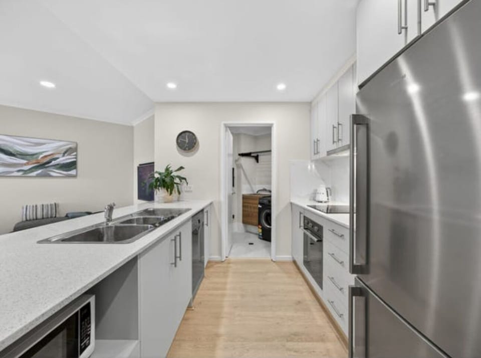 Well equipped modern kitchen with Smart touch screen cooking stove.