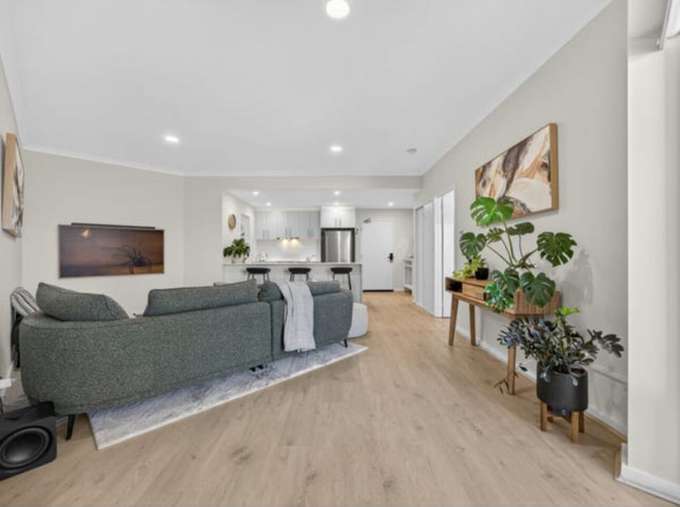 Spacious living room with smart 55" TV.