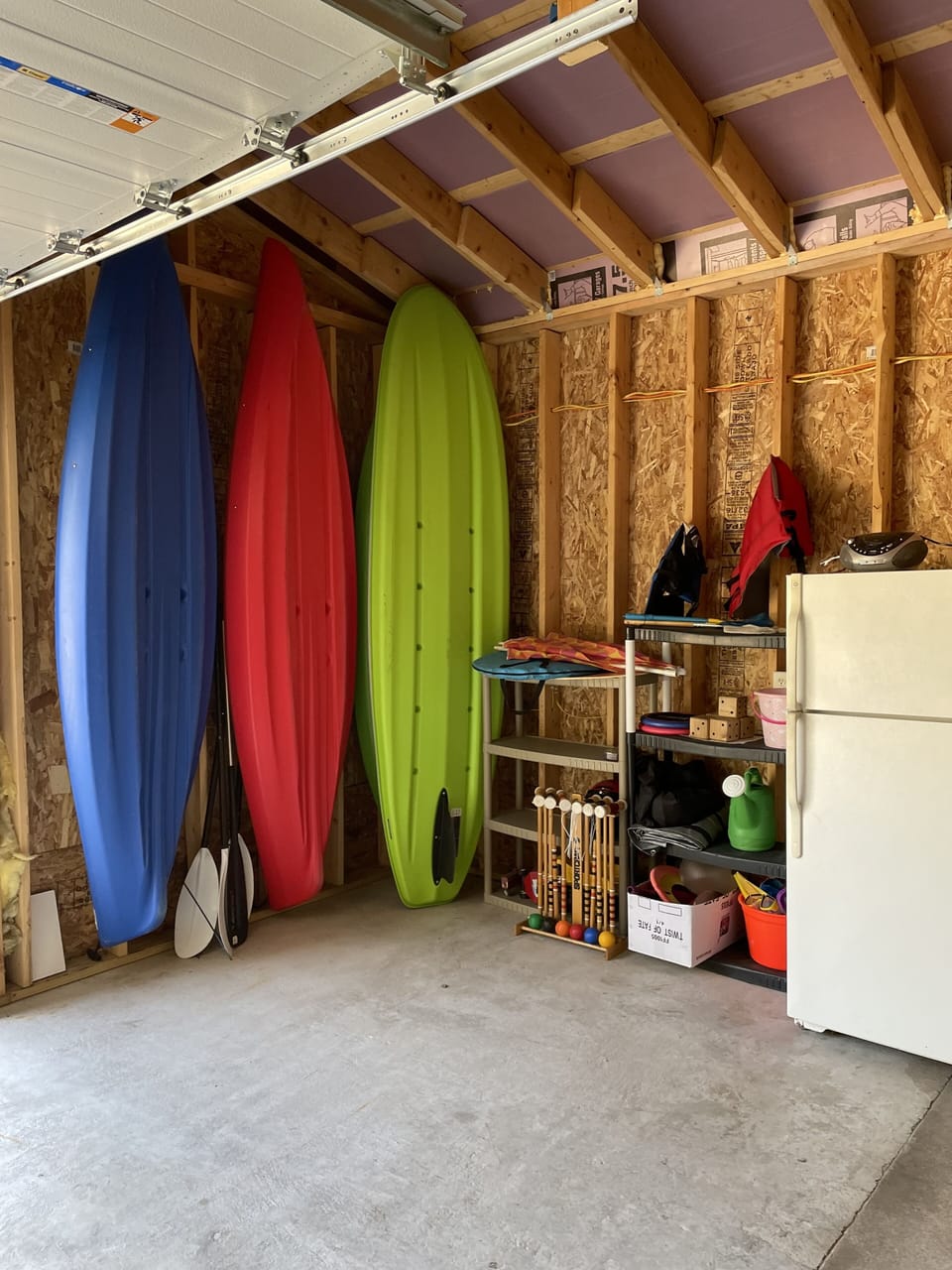 Kayaks and paddle board available for use. Garage fridge and yard games.