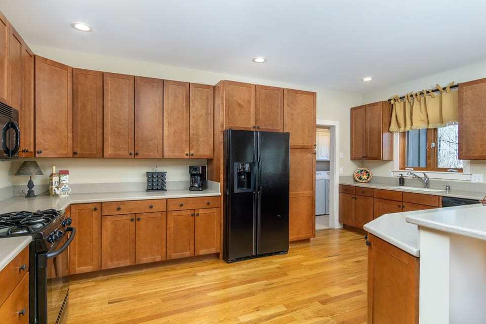 Kitchen with ample counter space, dishwasher & Keurig coffeemaker.