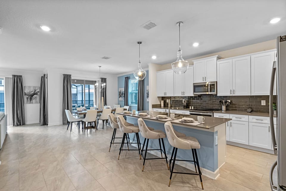 Dining table + kitchen counter will comfortably seat up to 14 people! 