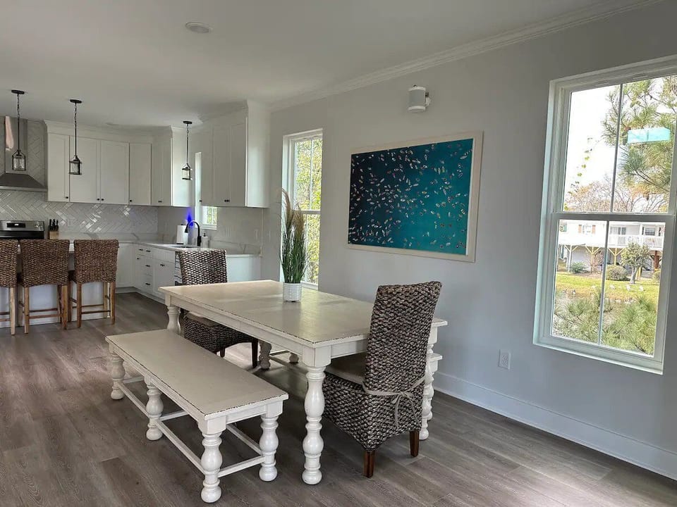 Large windows overlooking tidal pond. Spacious kitchen table.