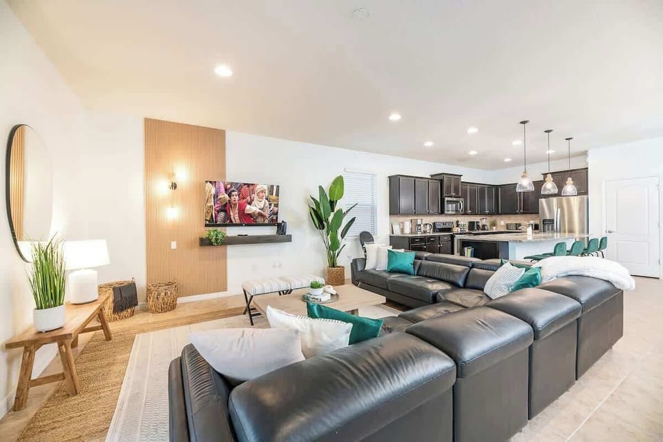 Enjoy Cozy Sofas & Large 55" Flat Screen TV with 125+ Free Cable Channels, Including Disney Channel