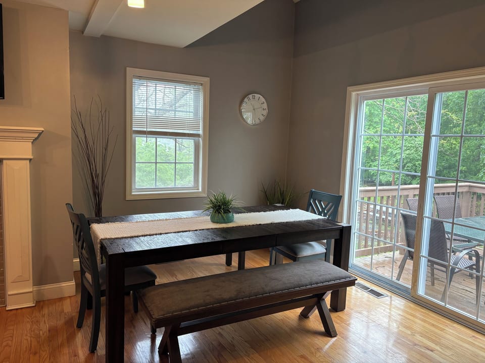 Dining room table with sliders going to the deck second floor