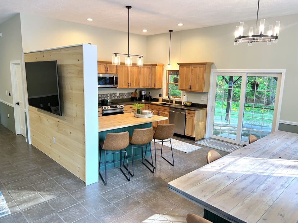 Kitchen & Dining Area - Twelve foot dining table with window bench banquette.