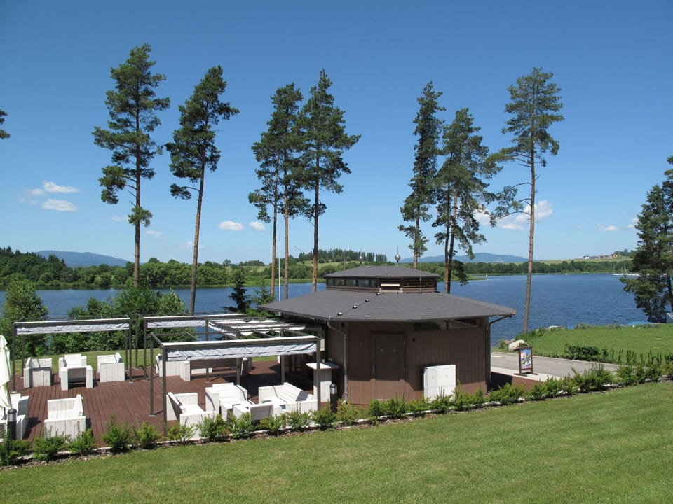Water, Plant, Sky, Property, Building, Tree, Lake, Land Lot, Shade, Cottage