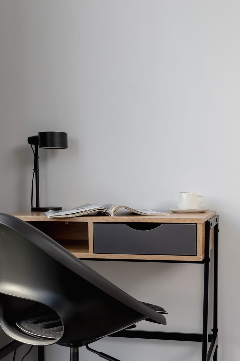 A compact workspace with a desk and chair, ideal for remote work or studying.
