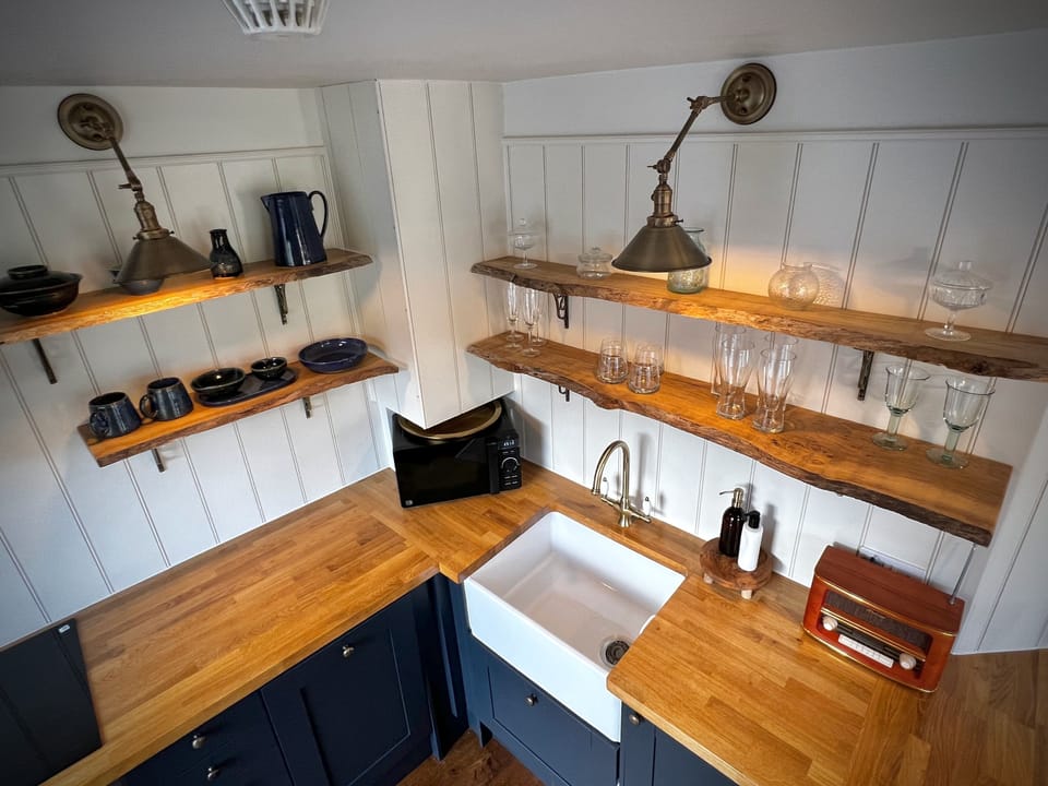Large farmhouse sink in addition to a dishwasher
