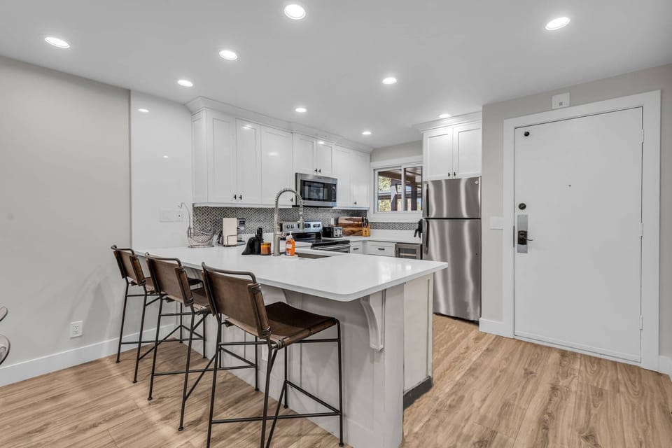 Kitchen: Well-equipped kitchen, updated appliances, drip coffee maker and French Press, kitchen bar w/4 bar stools 