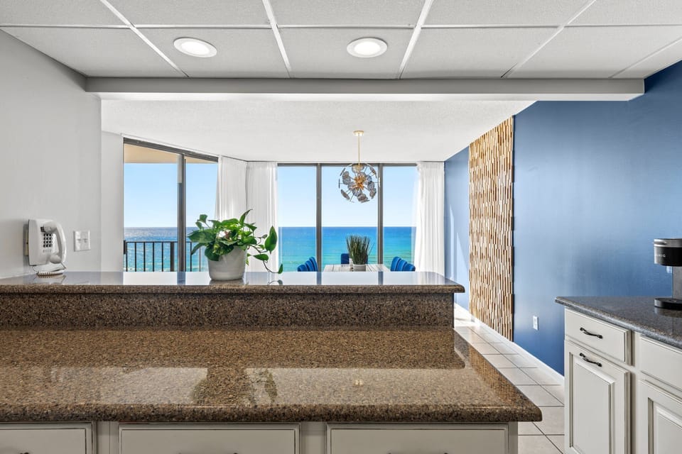 Modern kitchen with ocean views through large windows