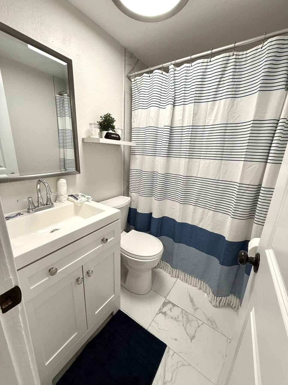 Full bathroom with shower and modern finishes