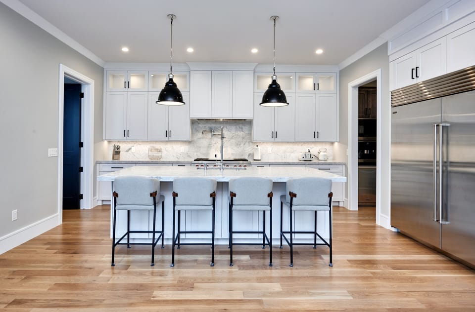 Enjoy meals in the gourmet kitchen with wolf range, subzero fridge .