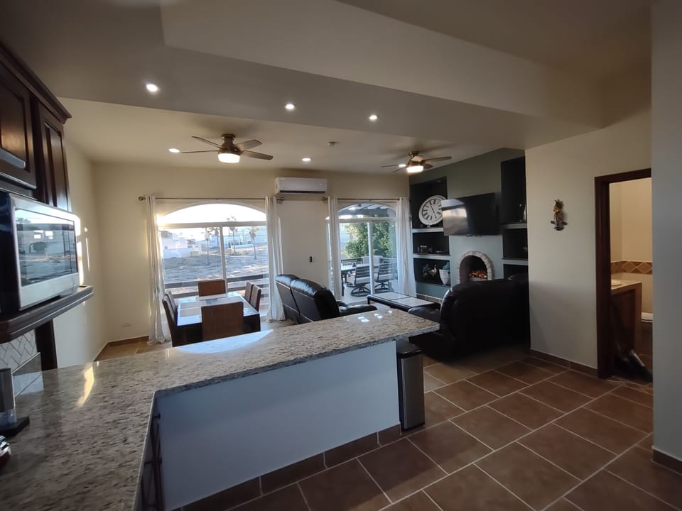 Kitchen with new granite counters, microwave, full size stove/oven, keurig.