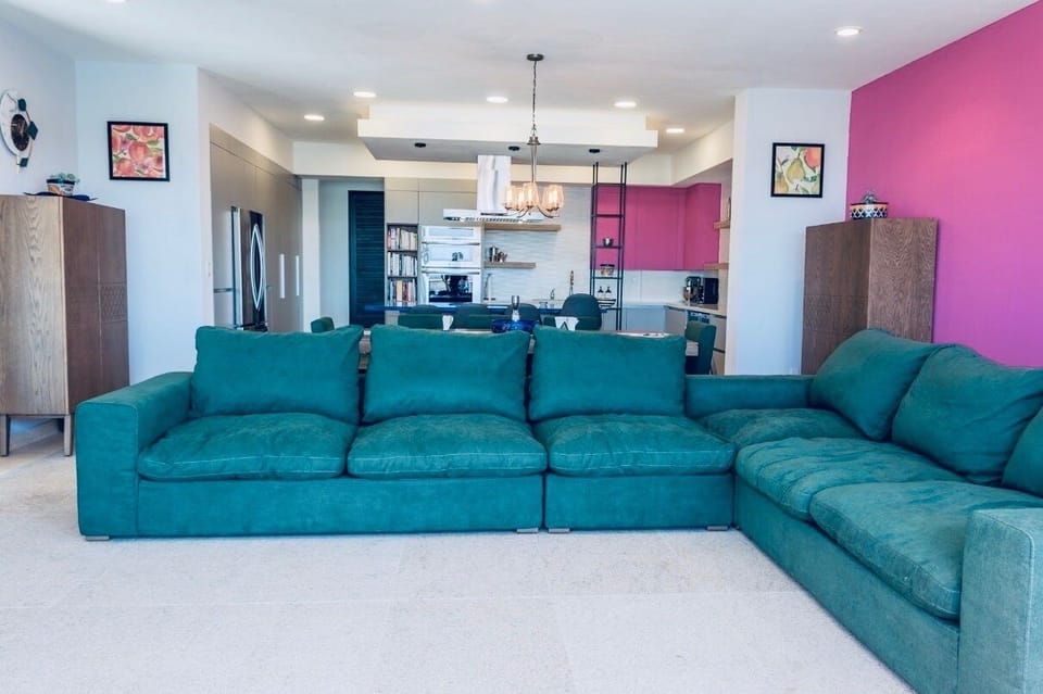 Open area with kitchen, dining and living room.  View of the marina and ocean. 