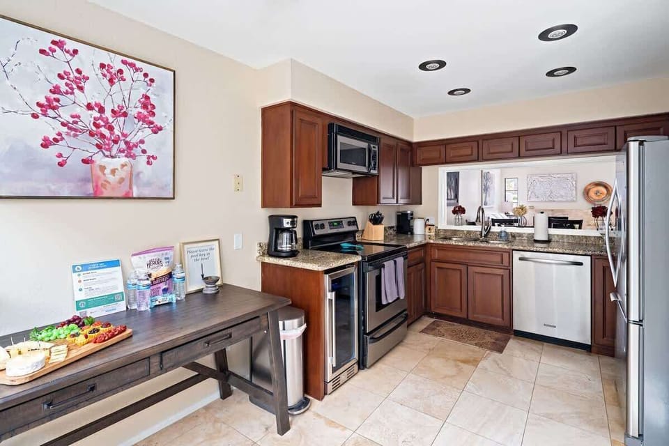 1st Floor: Fully equipped kitchen featuring stainless-steel appliances and completely stocked with all culinary essentials for ease and convenience during your stay.