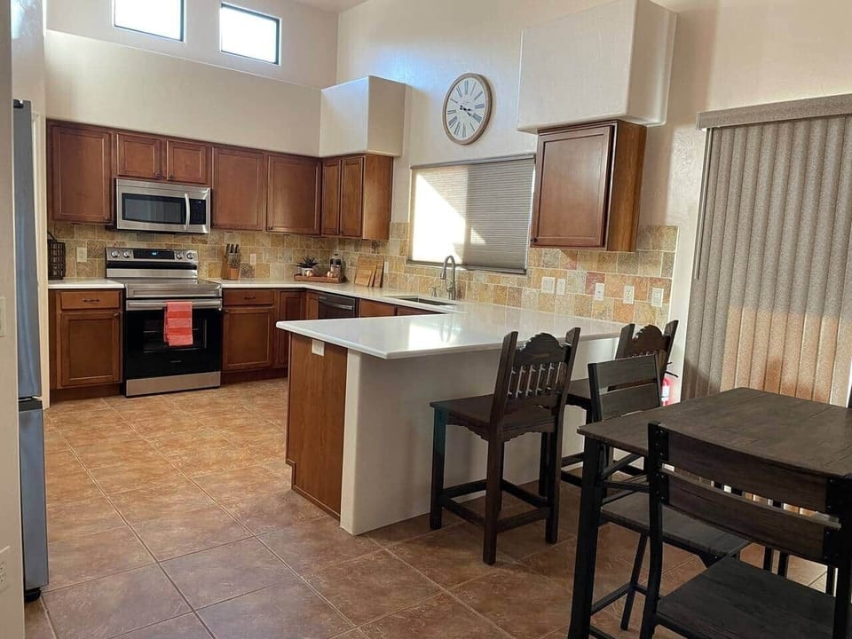 Kitchen and dinette area. Dinette seats 4. Bar seats 2. 