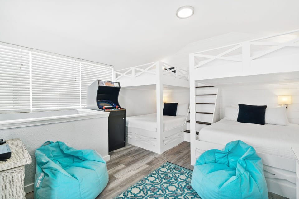 Level 3 Queen over Queen Bunk Beds with Game Machine and Balcony overlooking Pool