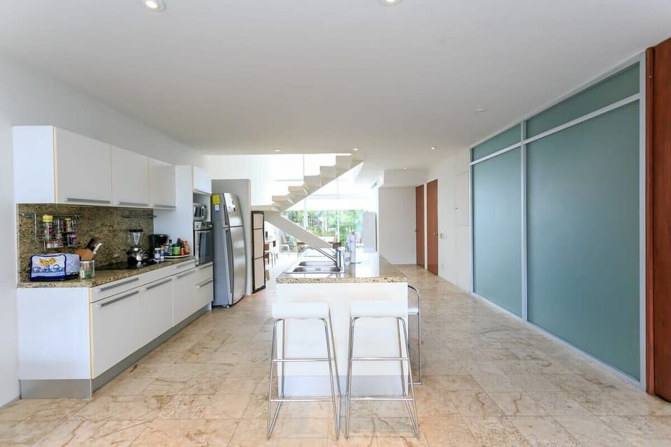 The kitchen island has plenty of seating so everyone can hang out together