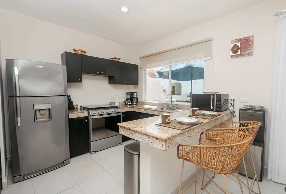 Fully equipped kitchen with modern appliances, perfect for preparing meals and enjoying your stay