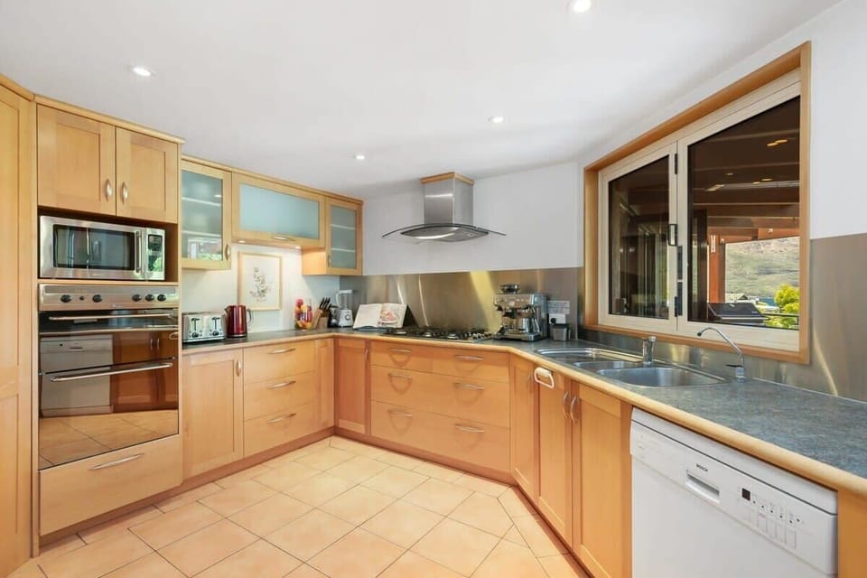 Kitchen: Modern appliances and ample space for culinary adventures with stunning mountain views!
