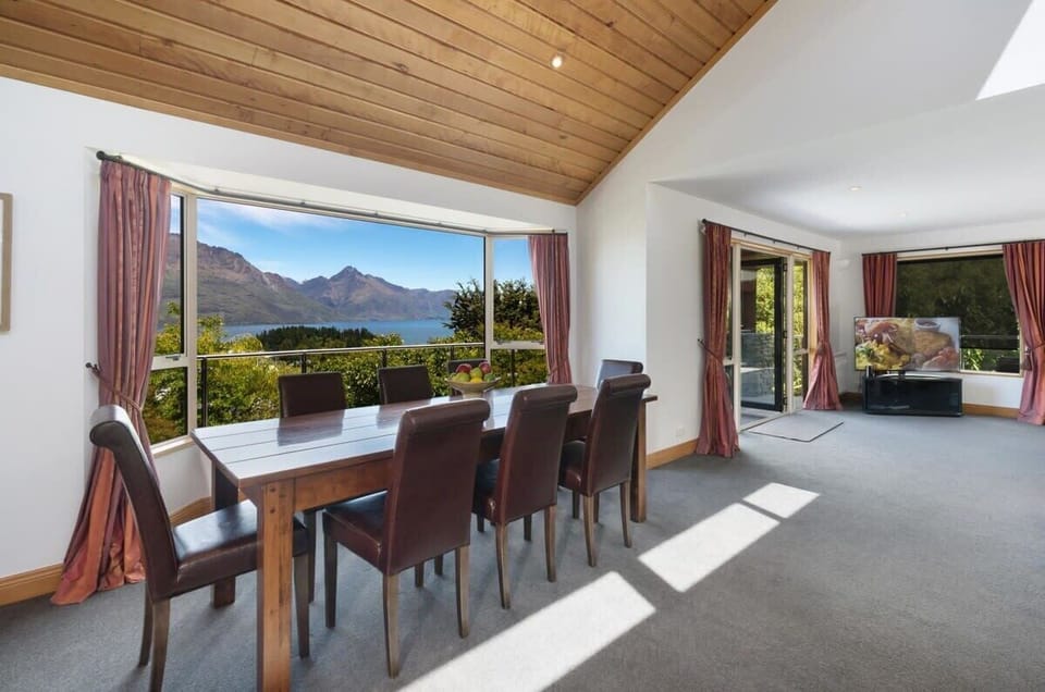 Dining Room: Gather around the sleek table and soak in breathtaking mountain views!