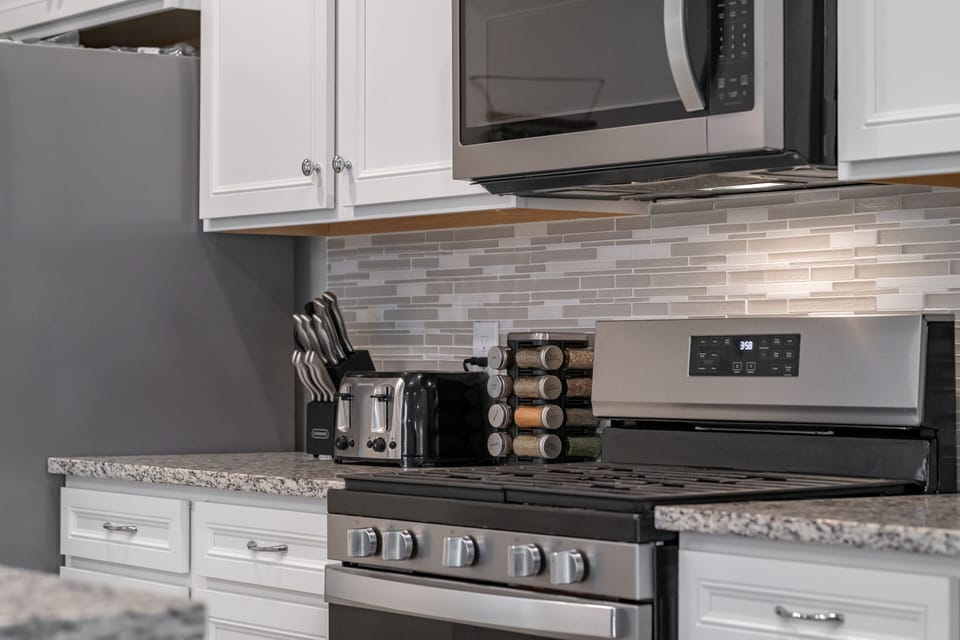 Fully loaded kitchen including tea kettle and rice maker. 