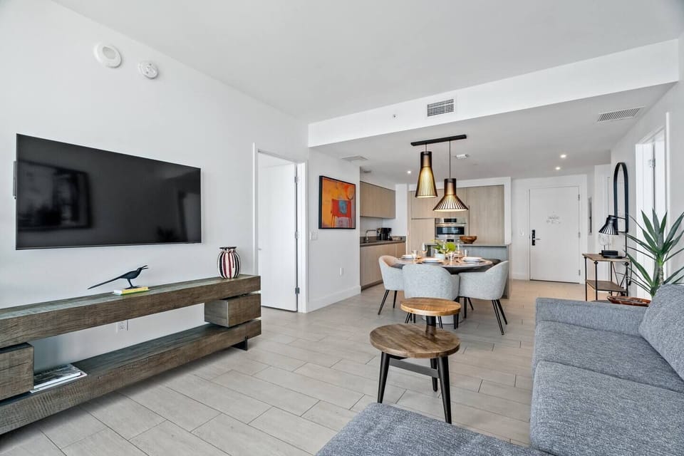 The main living room with 55" TV that connects to cable and streaming services. Our wifi is super fast as well!