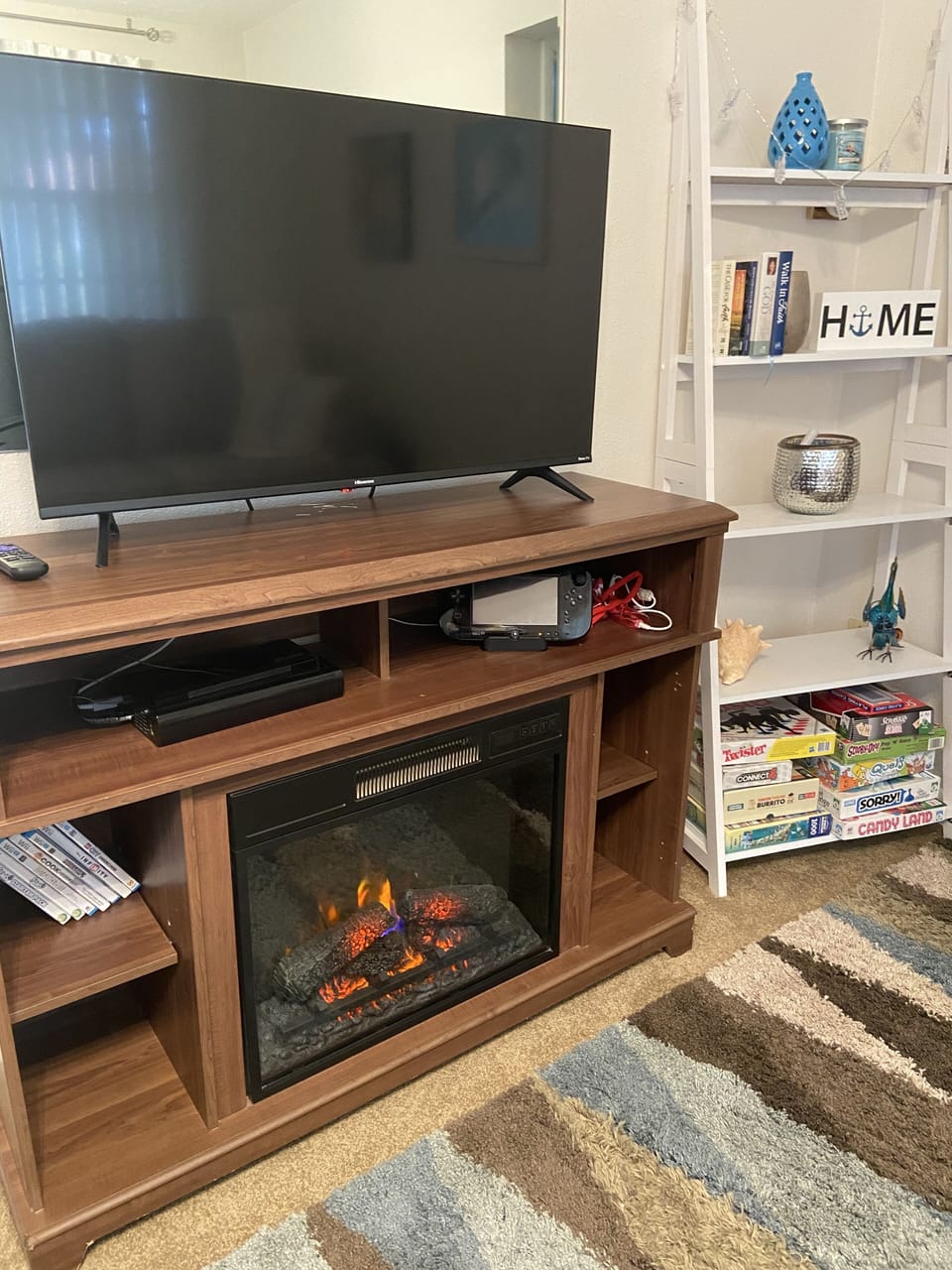 Living room w/electric fireplace, Wiiu, and pull out sofa