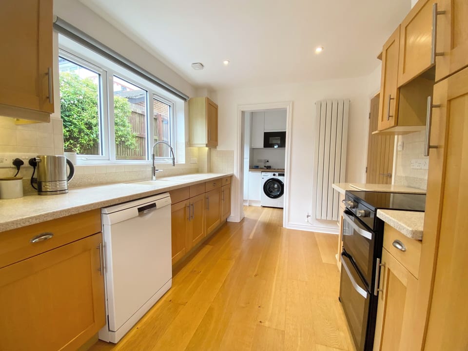 Kitchen with oven, dishwasher, fridge freezer & coffee maker