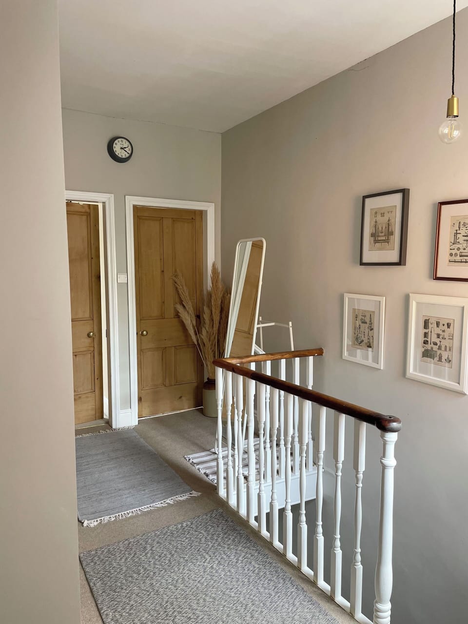 The upstairs landing area with full length mirror. 