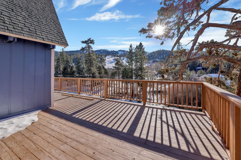 Private outdoor deck, surrounded by tall pines, perfect for relaxing under the trees after a day of adventure—enjoy peaceful forest views, fresh air, and a truly rejuvenating stay.