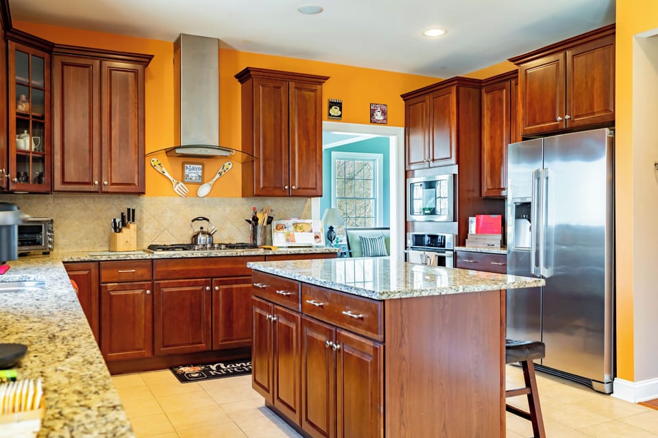 Main Kitchen with 5 Burner Gas Range, Oven, Dishwasher and Microwave.
