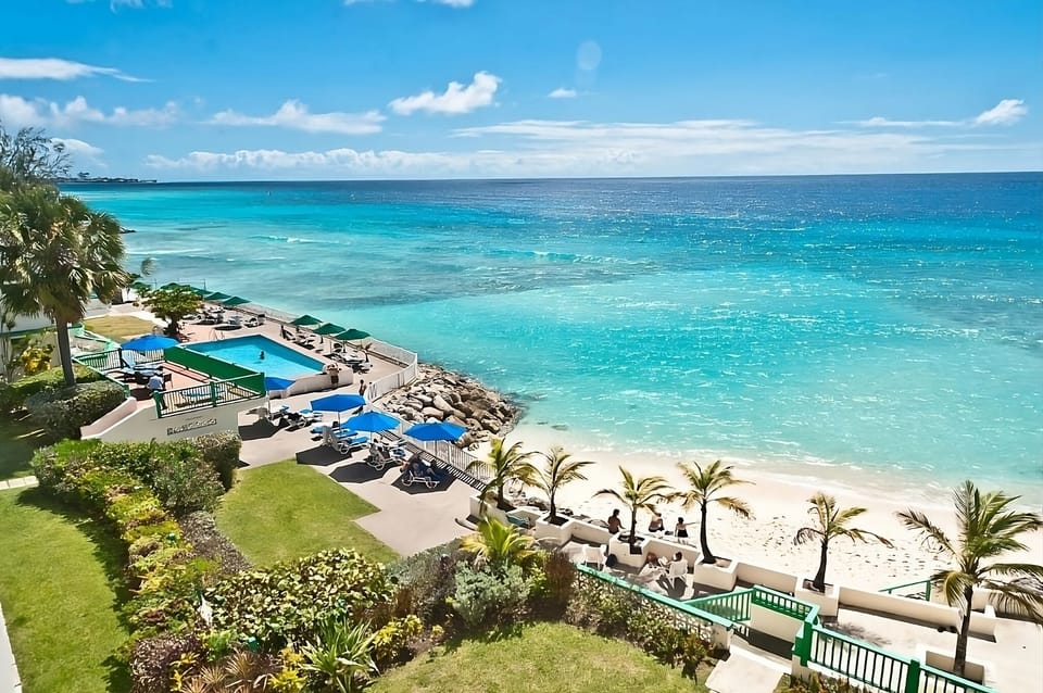 Soak in sweeping turquoise views from this beachfront escape.