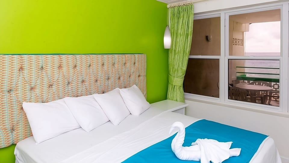 Wake up refreshed in crisp linens beside breezy windows.