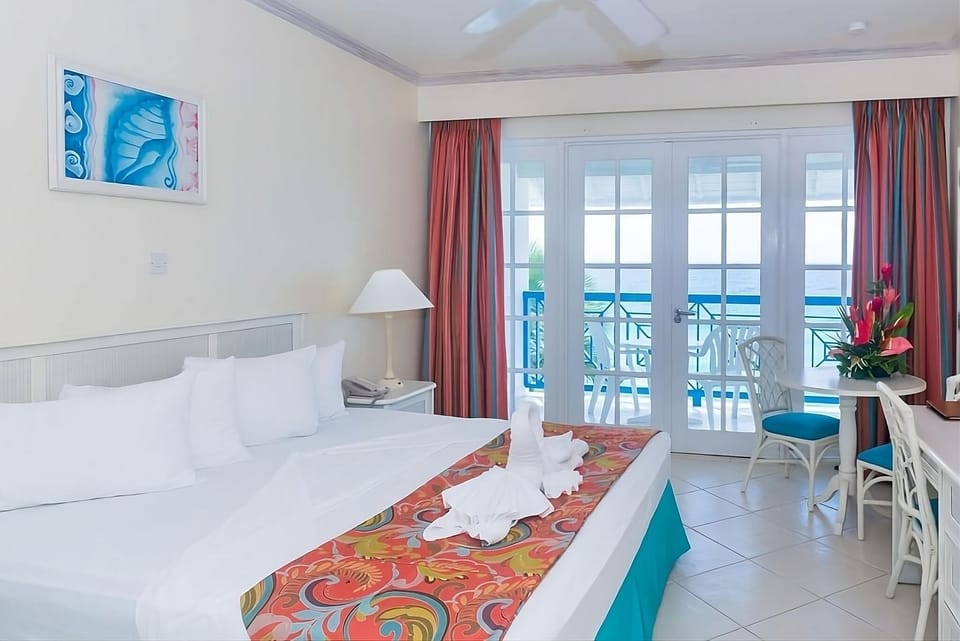 Slip into serenity with balcony doors opening to ocean air.