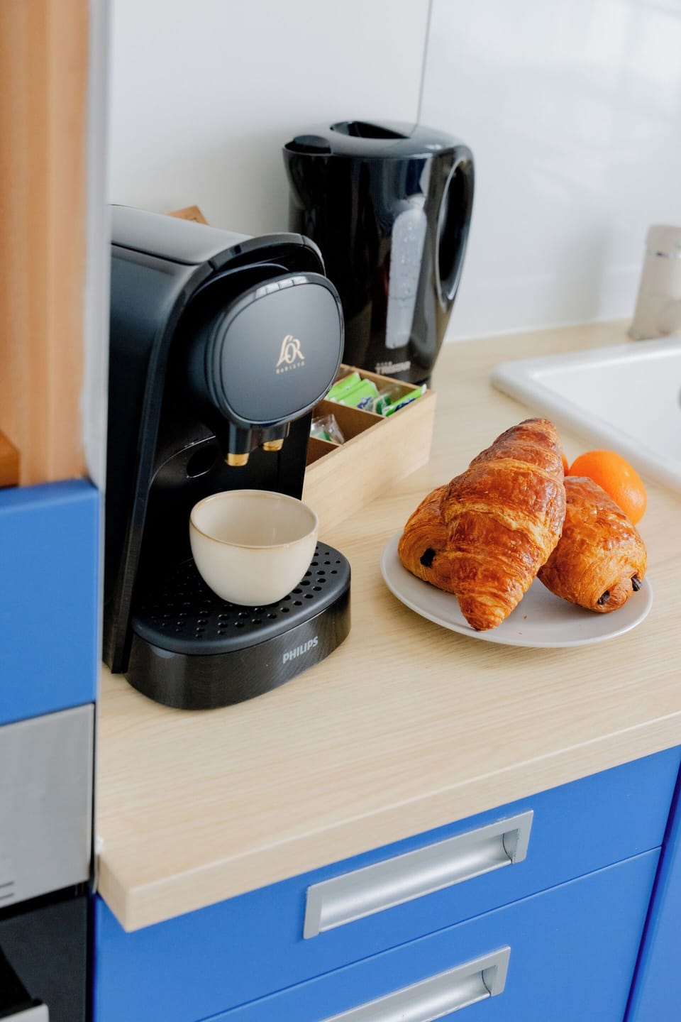 Modern kitchenette with coffee/tea station for easy mornings