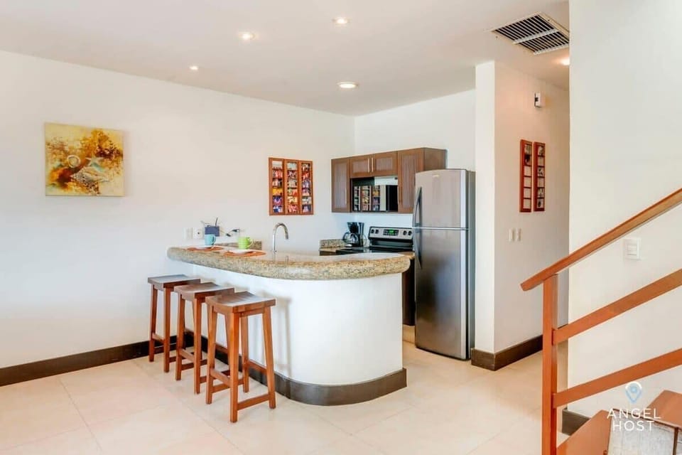 The breakfast bar can serve as a laptop-friendly workspace if needed